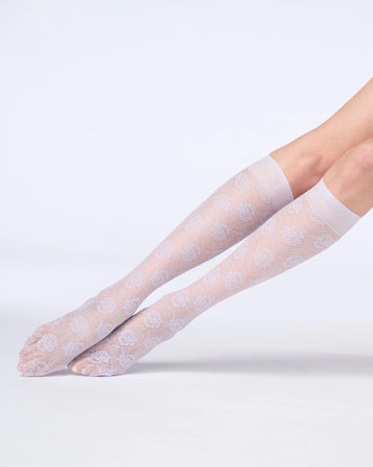 Lilac floral patterned knee-high socks on a white background