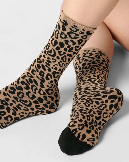 beige ankle socks with a black leopard print pattern