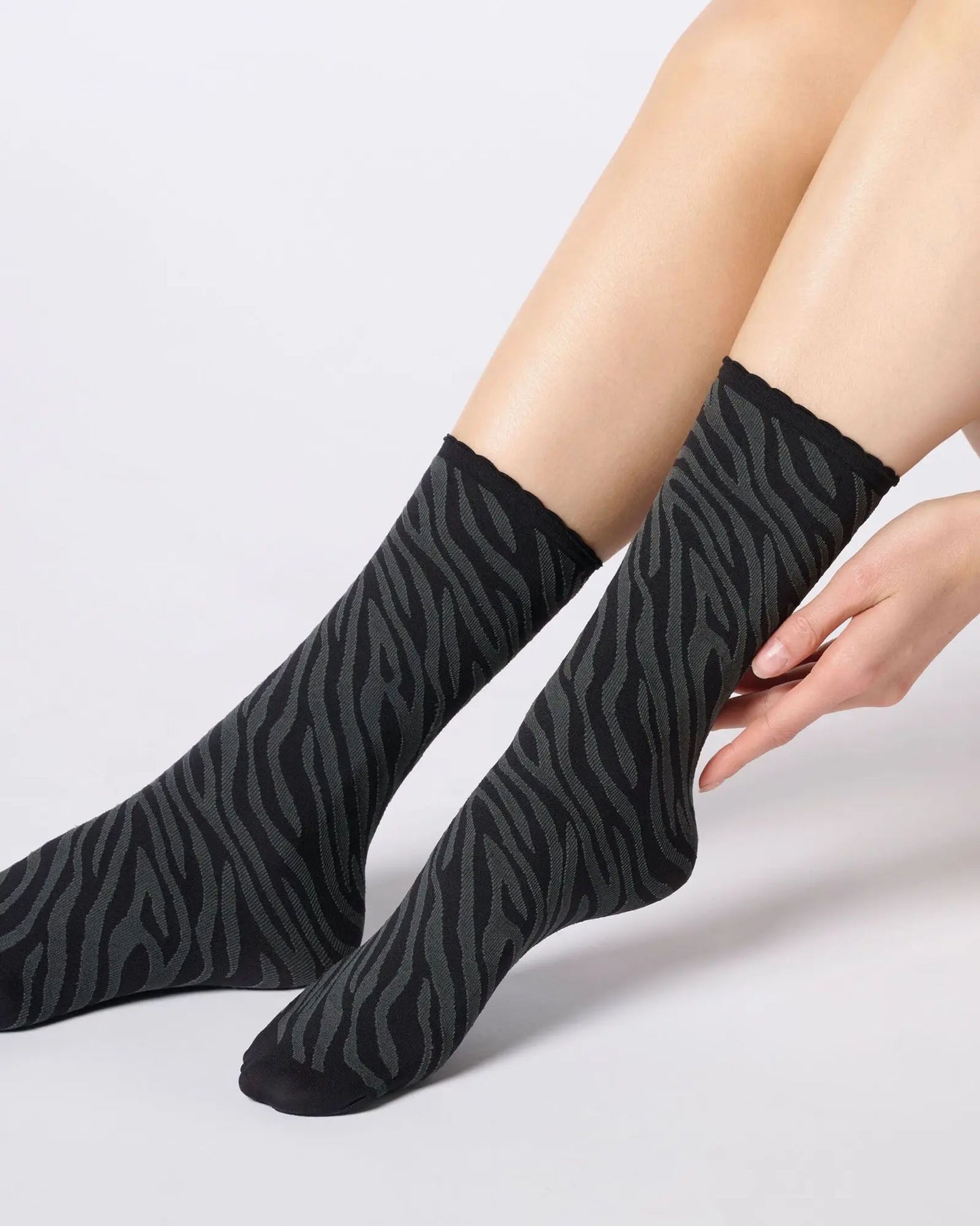 Black and grey zebra print ankle socks.