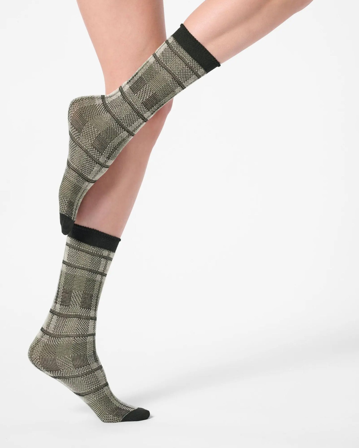 Light sage green ankle socks with a large tartan pattern, black toe and cuff.