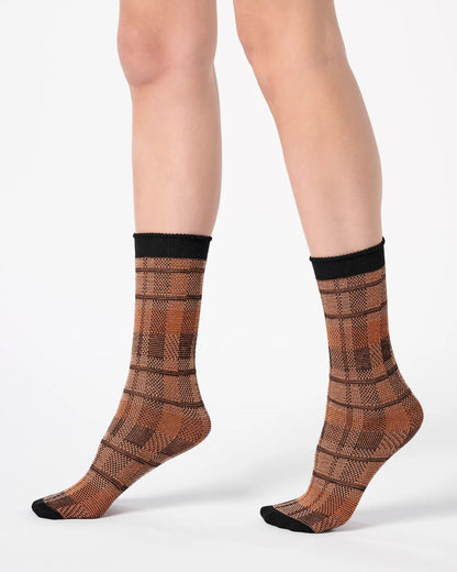 Rust orange ankle socks with a large tartan pattern, black toe and cuff.