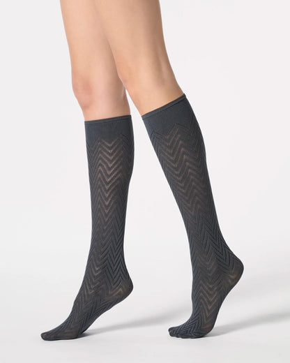 Dark grey opaque knee-high socks with a chevron pattern.