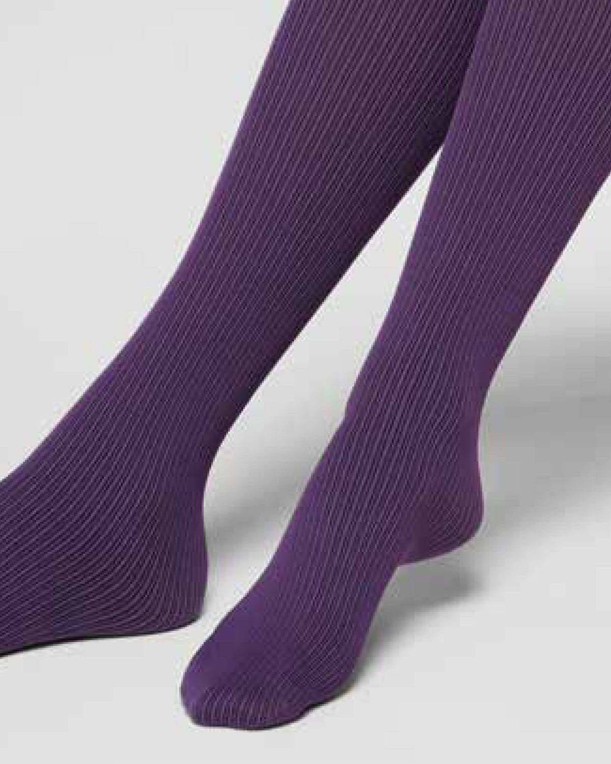 close up of dark purple knee socks with a black pinstripe rib
