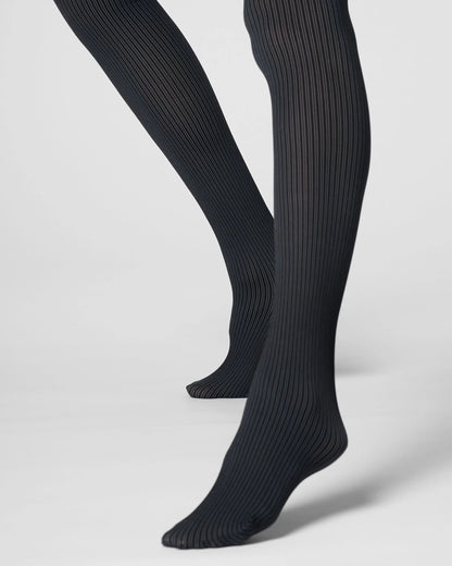 Grey ribbed tights worn on legs, shown from the calves down against a light gray studio background.