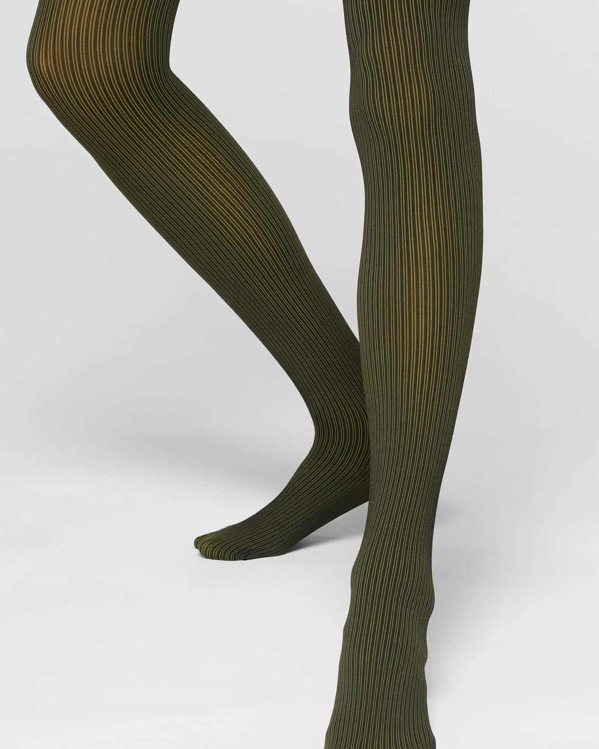 Olive green ribbed tights worn on a model's legs, shown against a clean light gray studio background.