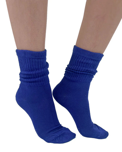 Blue socks worn on a white background