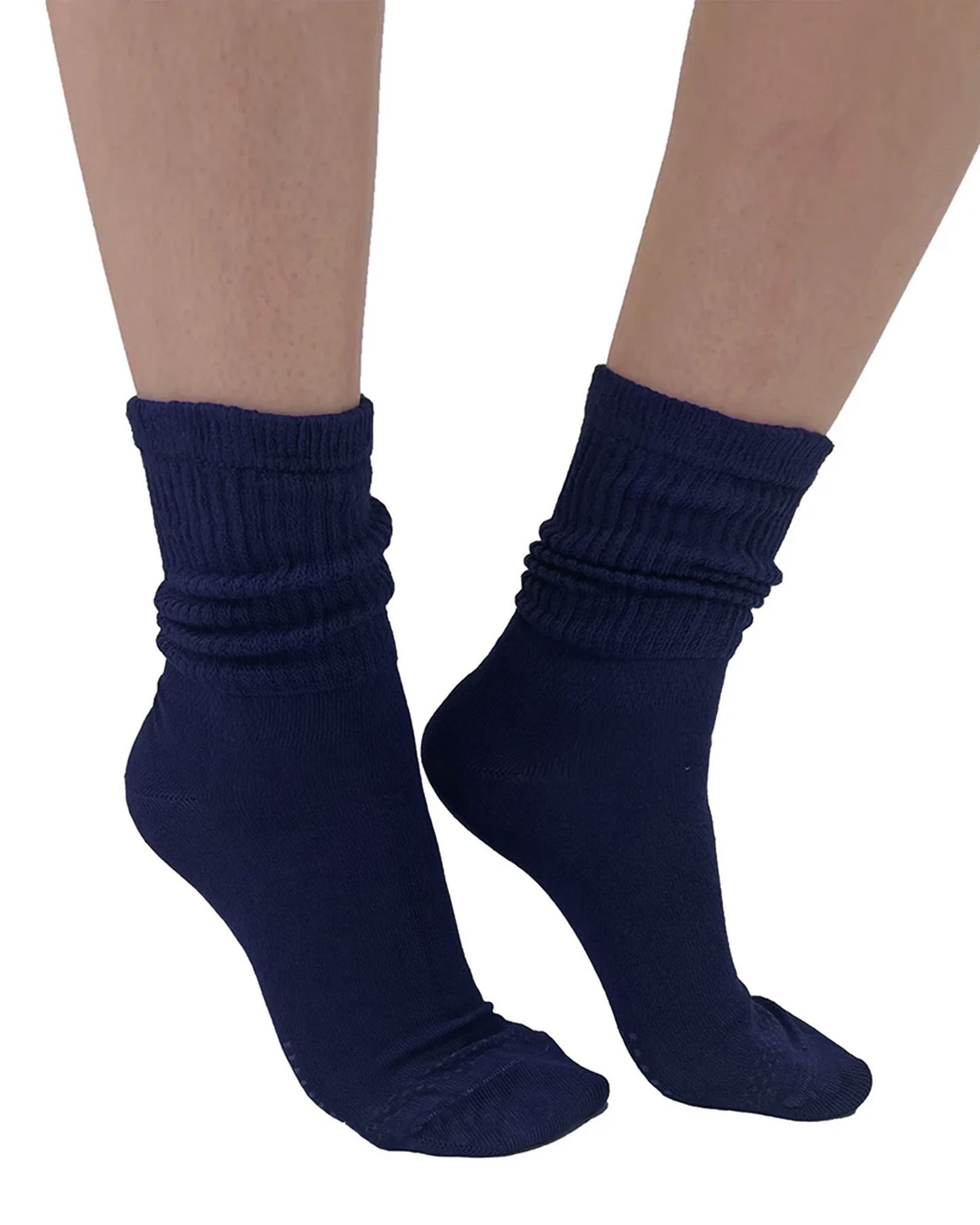 Navy blue socks worn on a white background