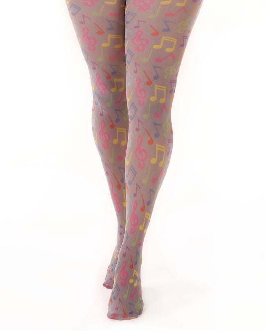 Pamela Mann Musical Notes Print Tights - Grey opaque tights with an all bright multicolured music notes print pattern. Close up.