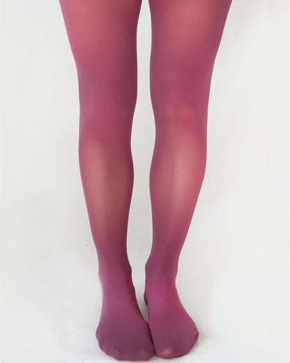 berry pink tights worn by a person on a white background