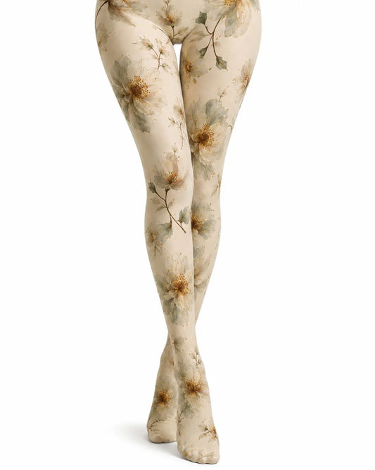 A pair of cream tights with a muted floral and leaf pattern in brown, olive green, and grey, shown on a model's legs against a white background.