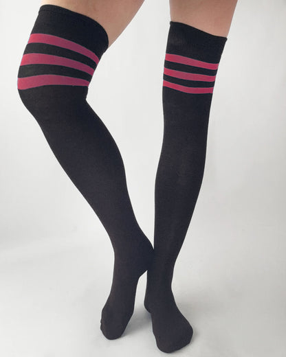 Black knee-high socks with pink stripes on a white background