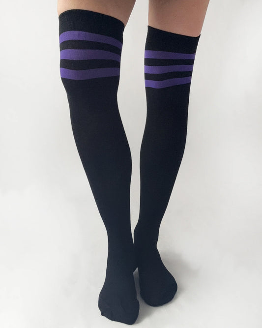 Black knee-high socks with purple stripes on a white background