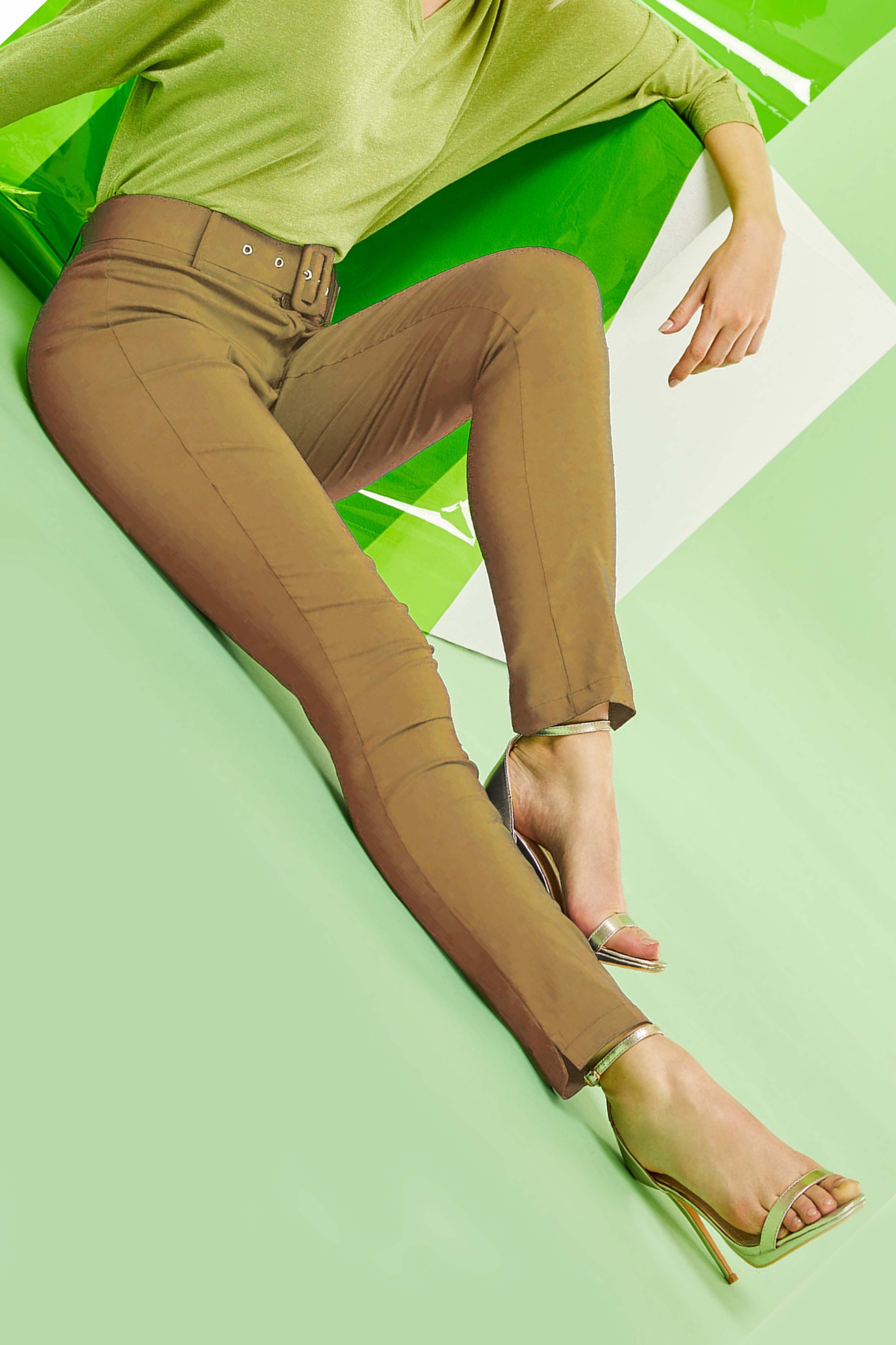 SiSi Belt Treggings - Camel tan coloured light weight high waisted stretch viscose trouser leggings (treggings), with 2 buttons and zip closure and matching belt. Worn with a lime green top, and gold heeled sandals.