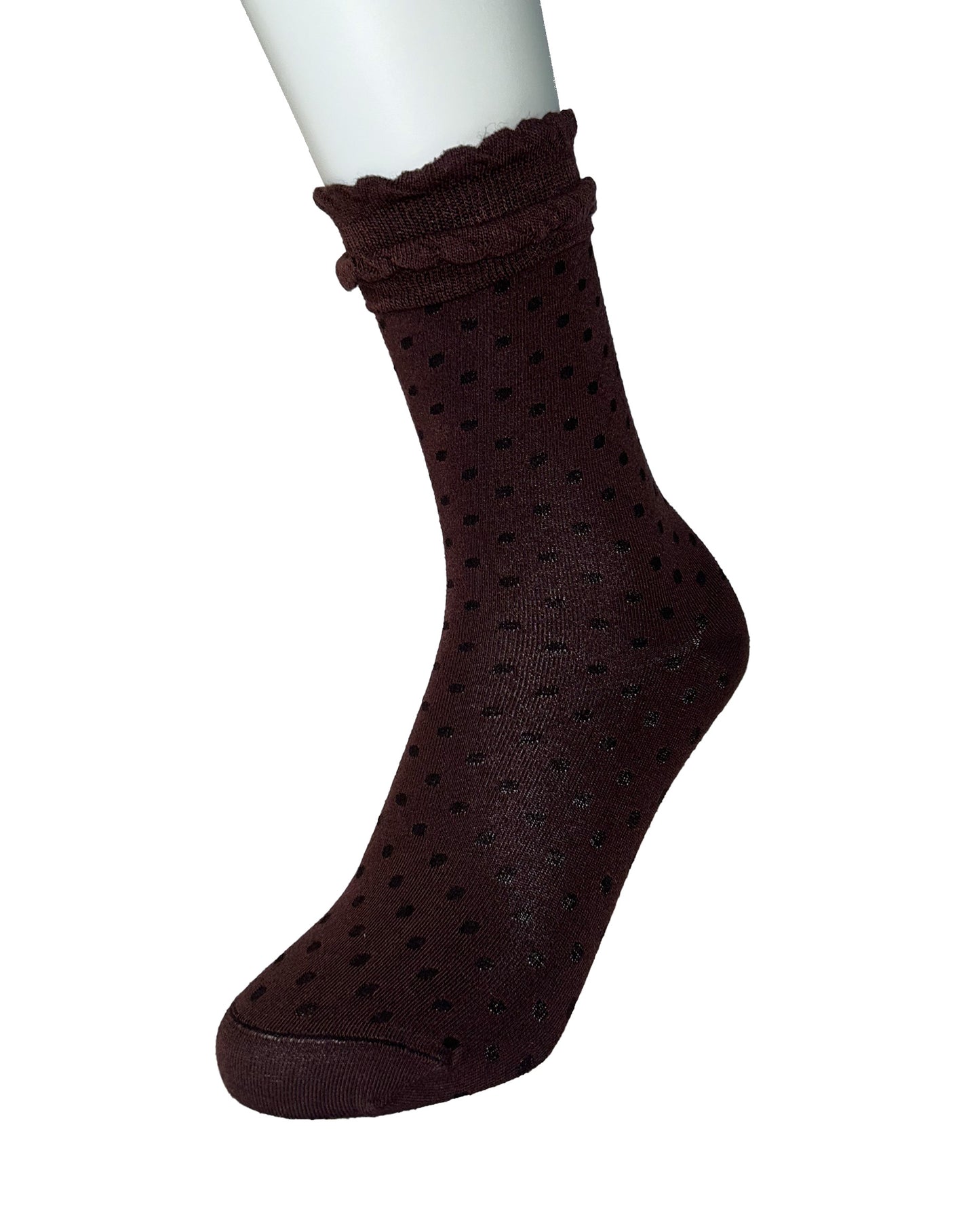 Brown sock with black polka dots with a frilly cuff on a white background