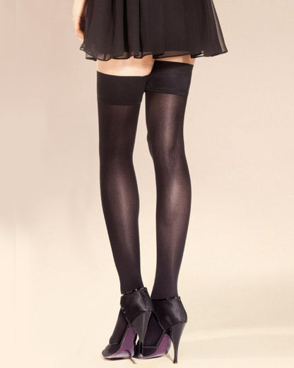 SiSi Queen 40 Micro Autoreggente - Black opaque hold-ups with a plain top, worn with black skirt and black heels.