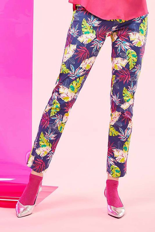 SiSi Tropical Treggings - Navy blue cotton stretch trousers with a tropical leaf style pattern in shades of pink, blue, purple and lime green, button and zipper closures, faux back pockets and side slits on the cuff.
