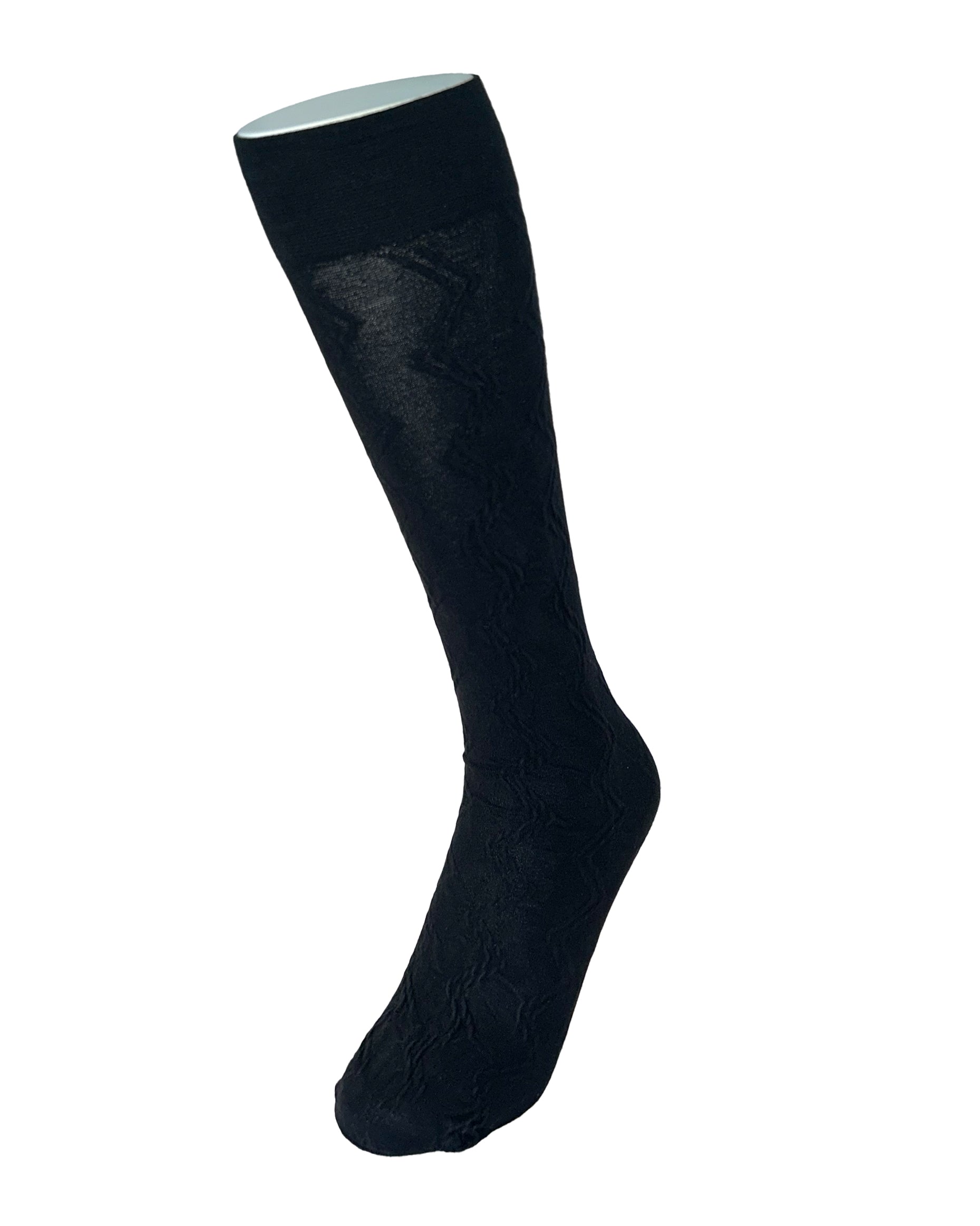 Black knee-high sock with a zig-zag texture on a white background