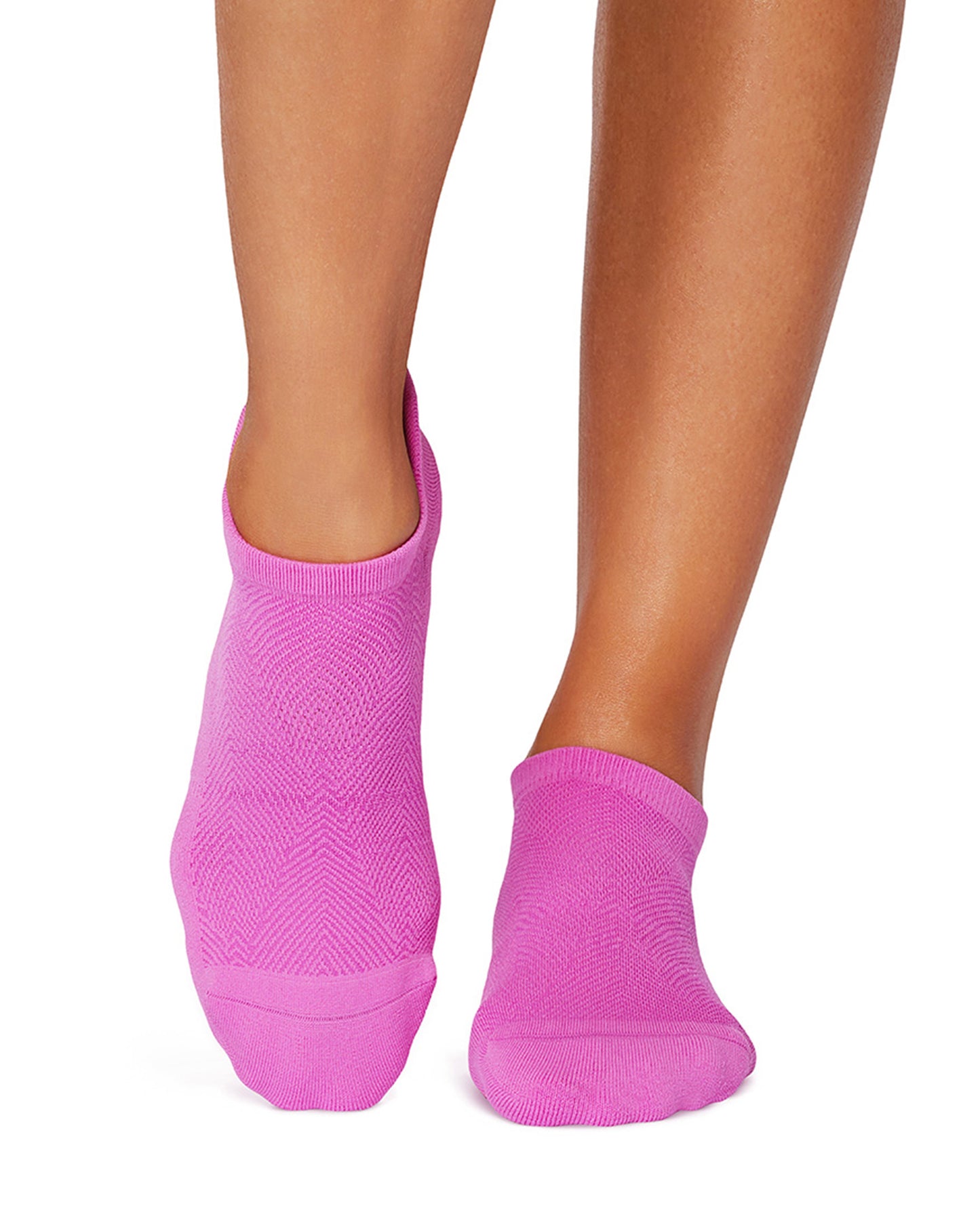 Pink ankle socks worn by a person on a white background
