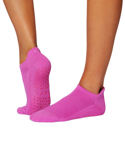 Pink socks with textured sole on a white background