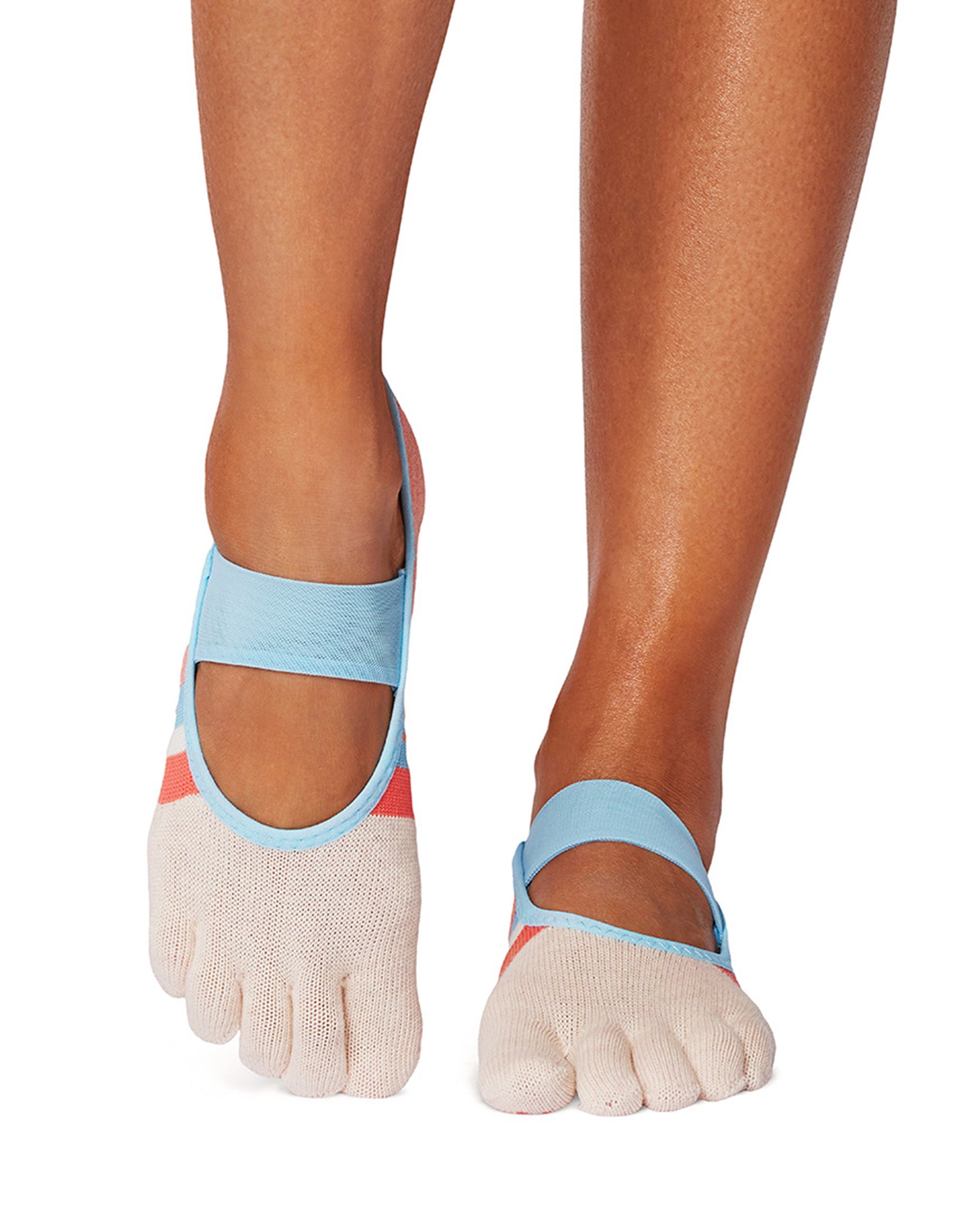 Close-up of feet wearing toe-separated socks with blue straps on a white background