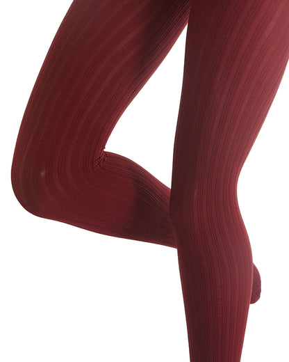 A close-up of a person's legs wearing dark red ribbed tights against a solid white background.