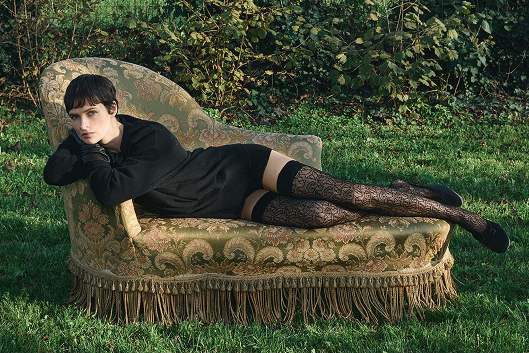 Trasparenze Compass Rose Auroreggente - Black openwork floral lace pattern fashion fishnet hold-ups. Worn with black jumper, suede pumps and leather gloves.