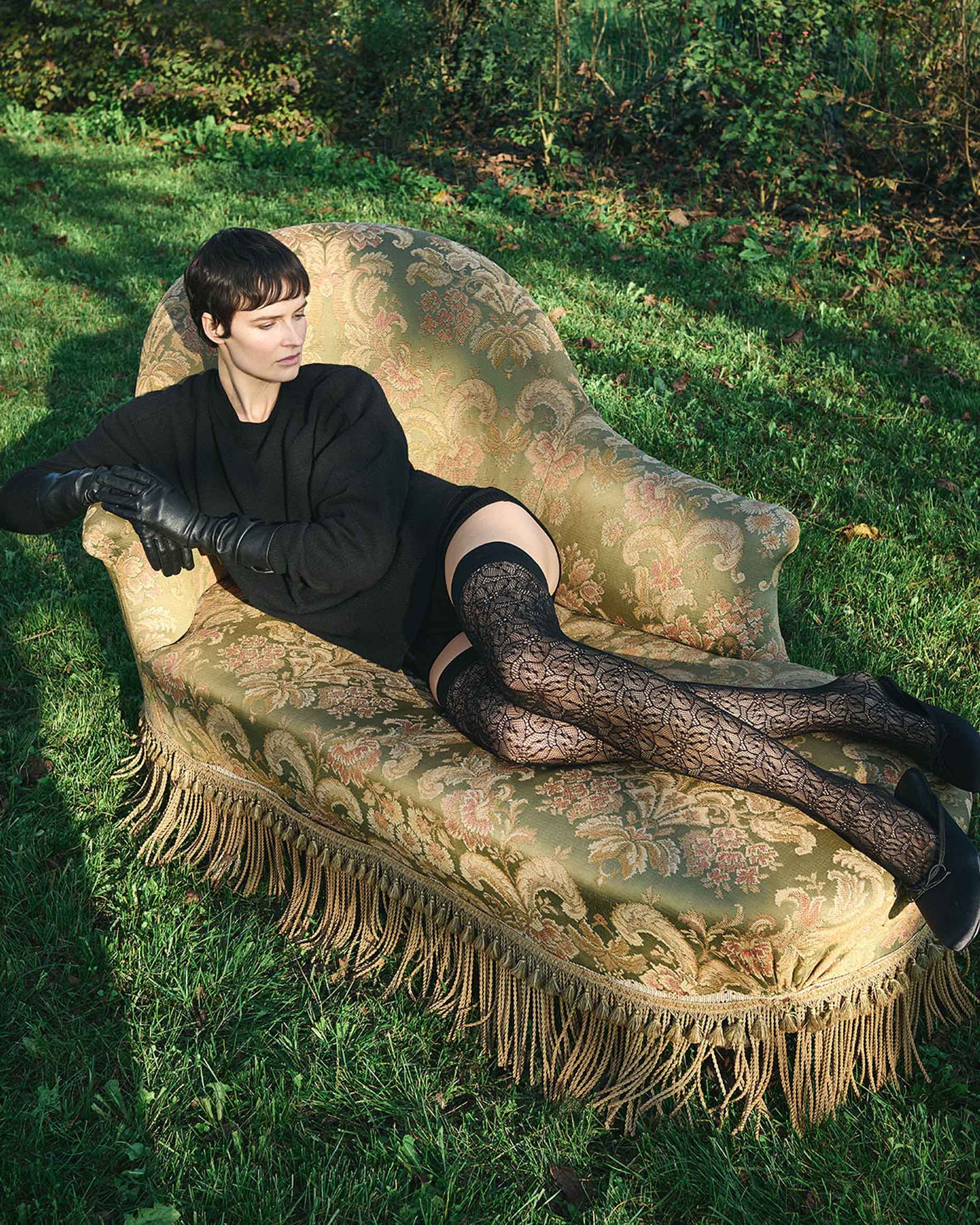 Trasparenze Compass Rose Autoreggente - Black openwork floral lace pattern fashion fishnet hold-ups. Worn with black jumper and leather gloves.