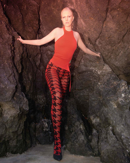 Trasparenze Copernicus Collant - Red opaque fashion tights with a bold and large black houndstooth pattern with contrasting colour. Worn with red halter neck top
