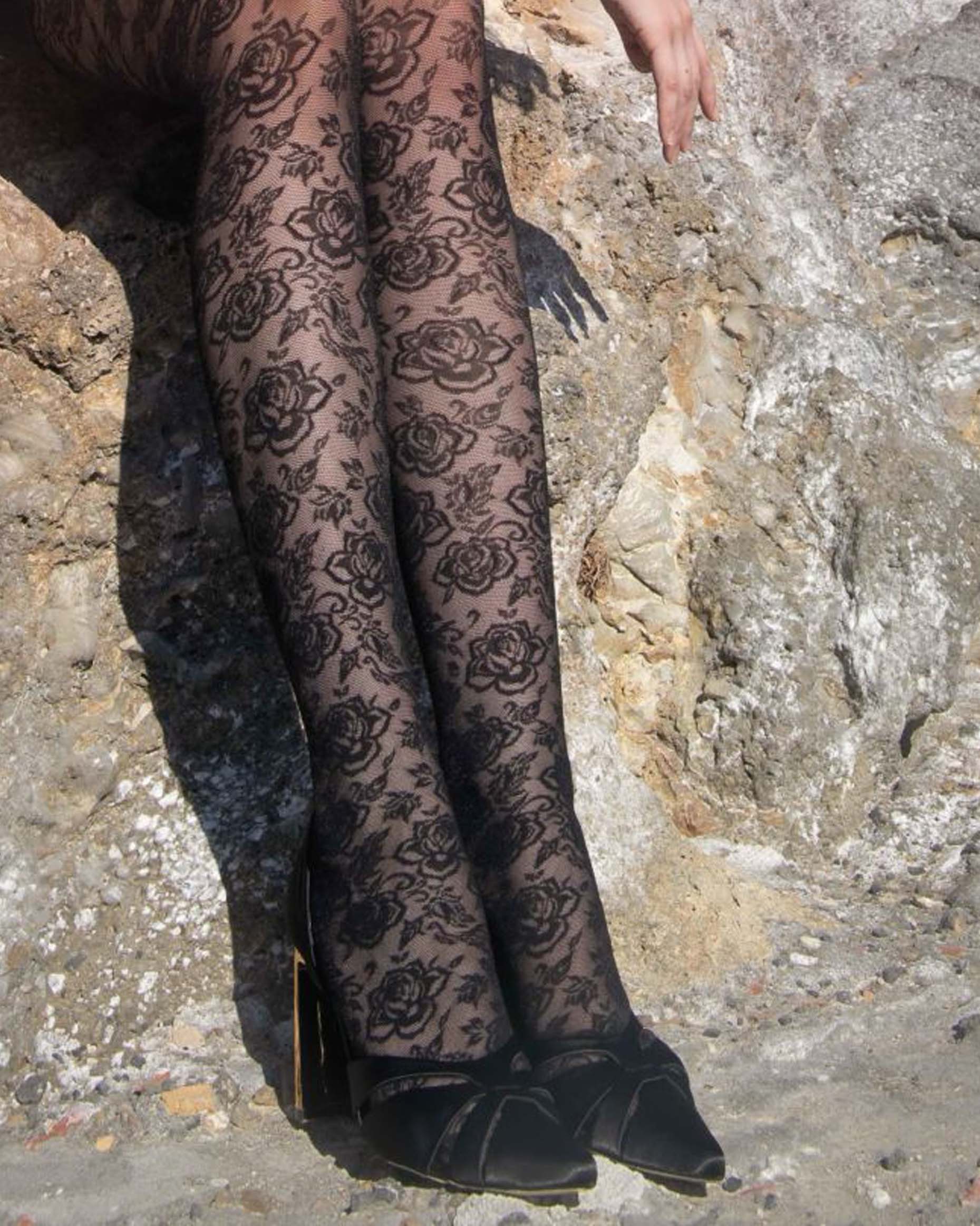 Trasparenze Enif Collant - Black semi sheer floral pattern tights with flat seams and gusset. Close up.