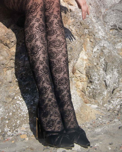 Trasparenze Enif Collant - Black semi sheer floral pattern tights with flat seams and gusset. Close up.