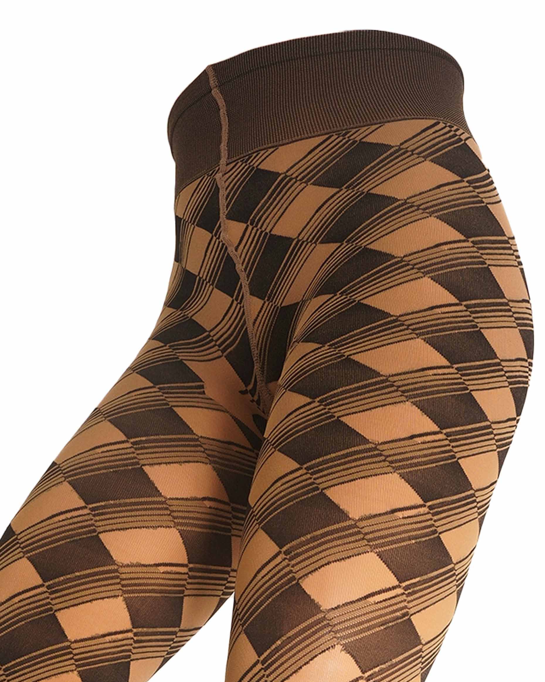 Close-up of a person wearing high-waisted leggings with a brown and tan harlequin diamond pattern, shown against a plain white background.
