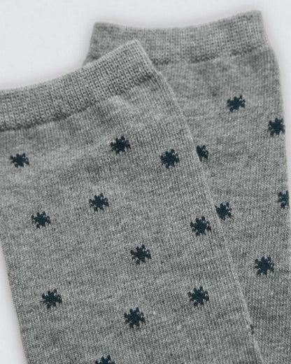 Grey socks with black pattern on a white background