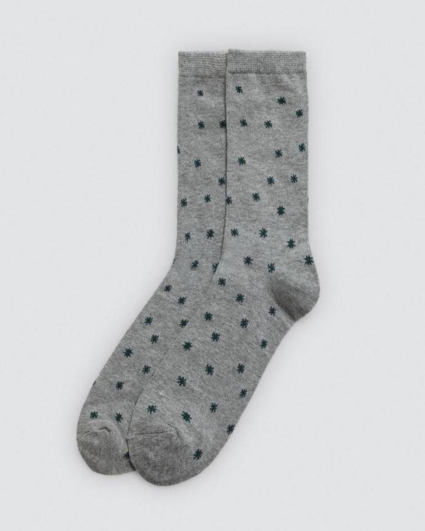Grey socks with black star pattern on a white background