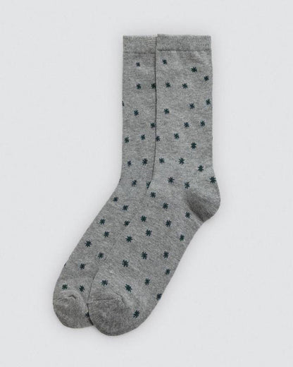 Grey socks with black star pattern on a white background