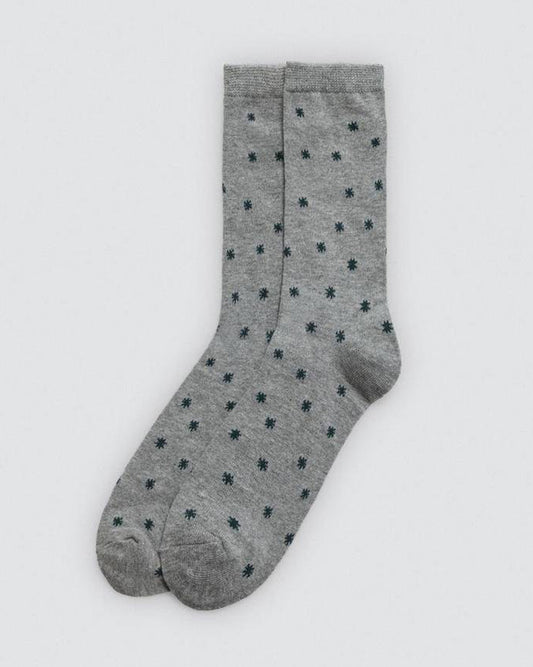 Grey socks with black star pattern on a white background