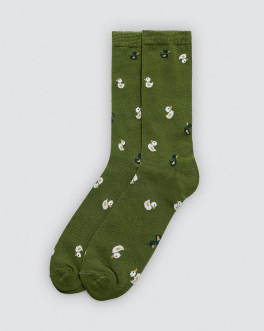 Green socks with duck pattern on a light gray background