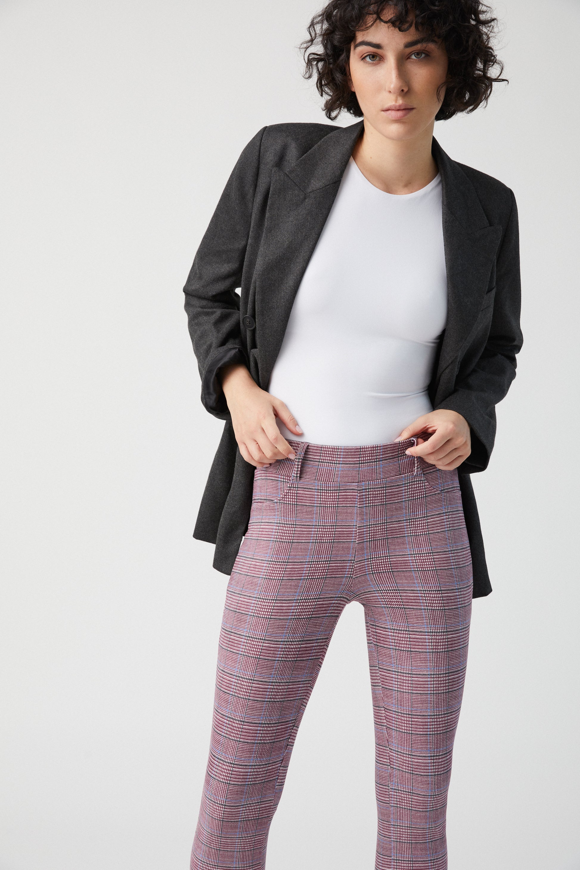 Ysabel Mora 70275 Pink Check Leggings - Soft white slimming trouser leggings (treggings) with an all over check print in plum (combined with white it looks pink), black and a small stripe of light blue, belt loops and faux front pocket top stitching.