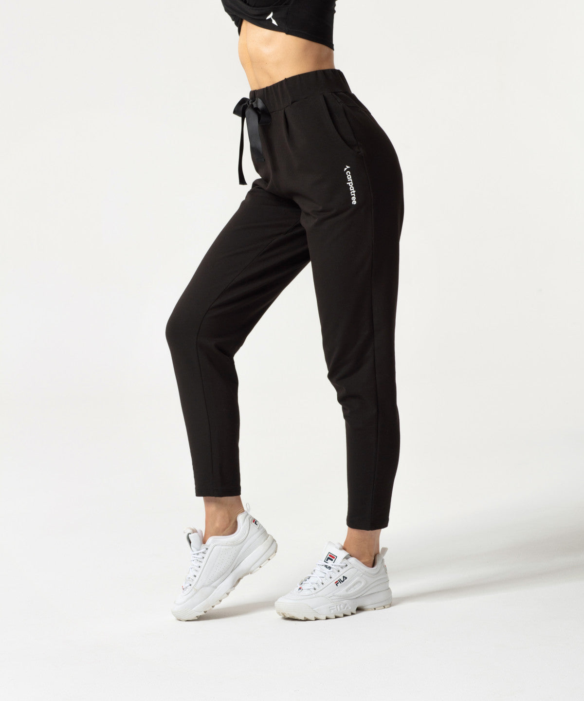 Carpatree Ultimate Tied Sweatpants - Black jogger style tracksuit bottoms with ribbon tie, elasticated waist and pockets. Made of strong stretch cotton.