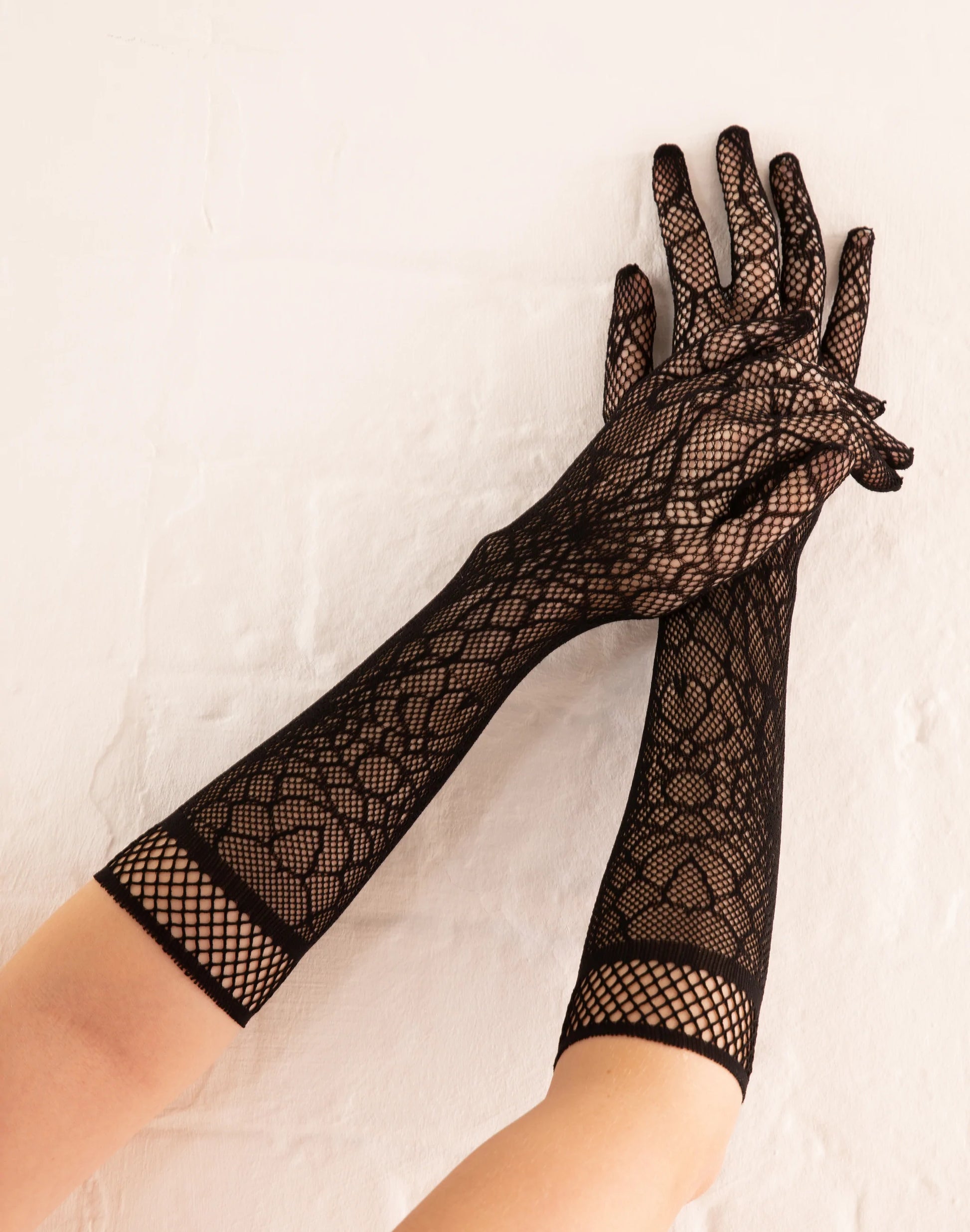 Pamela Mann Cobweb Net Gloves - Black openwork crochet fishnet gloves with an all over woven spider web style pattern and plain fishnet cuff.