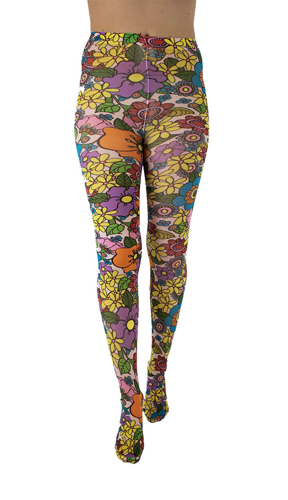 Pamela Mann Flower Power Tights - Pale pink opaque tights with a sixties style flower print pattern in bright shades of purple, yellow, blue, red, pink, orange and outlined in black.