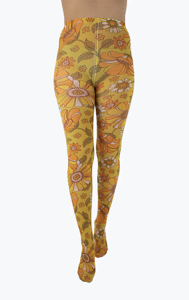 Pamela Mann Throwback Flower Tights - Cream opaque tights with a sixties style flower print pattern in bright shades of mustard and orange, outlined in brown.