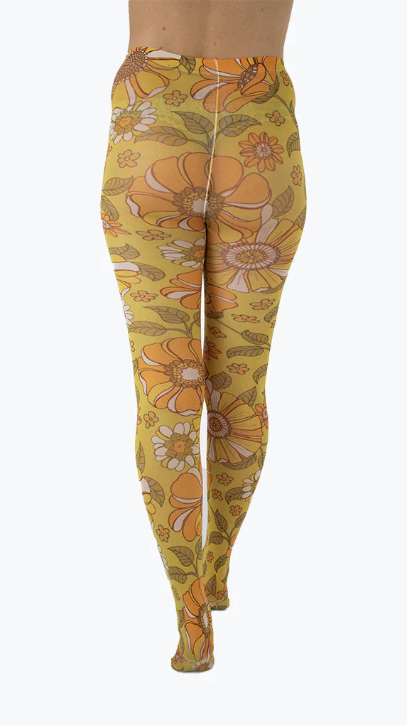 Pamela Mann Throwback Flower Tights - Cream opaque tights with a sixties style flower print pattern in bright shades of mustard and orange, outlined in brown.