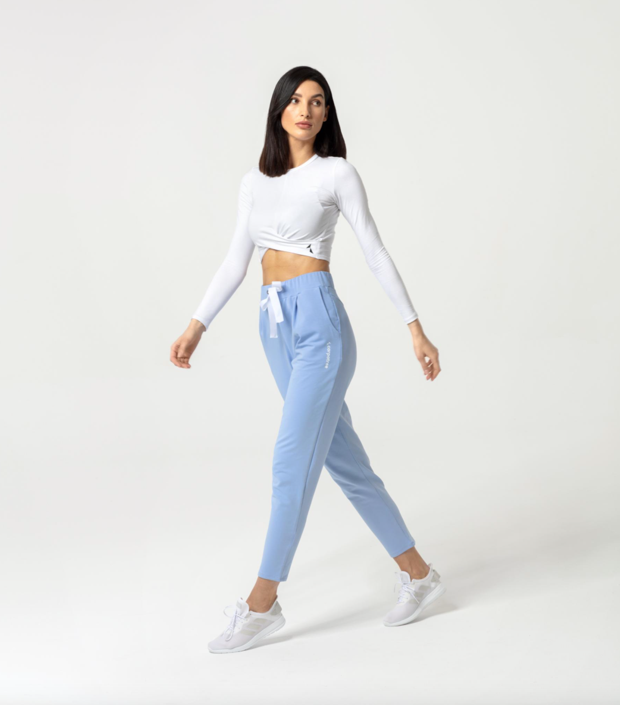Carpatree Gaia Longsleeve Top - White cropped long sleeve sports top with twist detail. Made of soft cotton.
