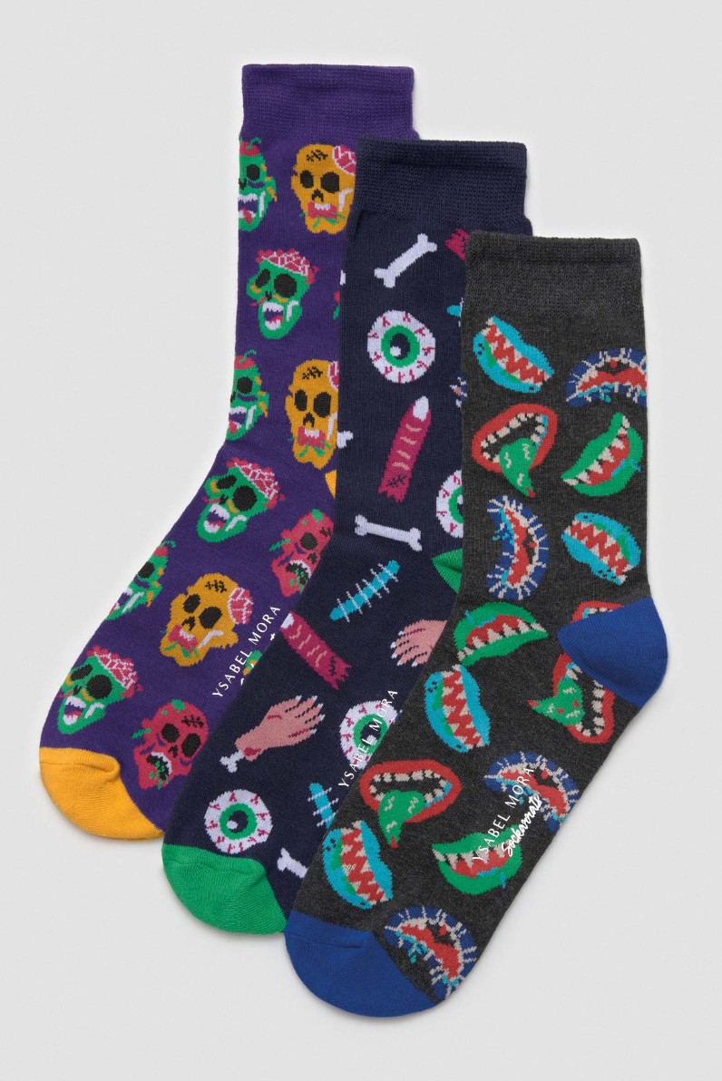 Pamela Mann Gruesome Skull Socks - Dark purple cotton crew length socks with an all over scary skulls pattern in green, yellow, pink, black and white, yellow heel and toe, perfect for halloween.