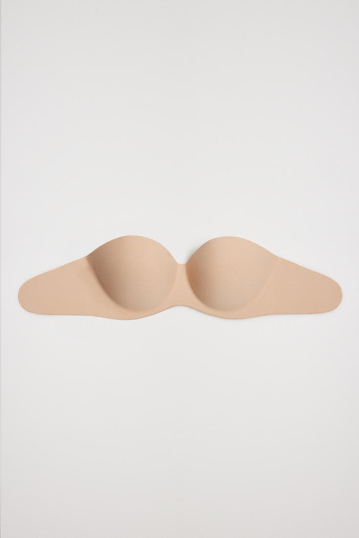 Ysabel Mora 10142 Adhesive Bra - Light push-up reusable adhesive bra. This bra is strapless and backless and adheres to the chest and sides, ideal for dresses and open back tops.