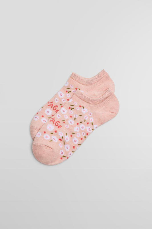 Ysabel Mora 12861 Savage Liners - Light pink cotton low ankle sneaker socks with an all over floral pattern in white and pink and "savage" written across the foot in pink.