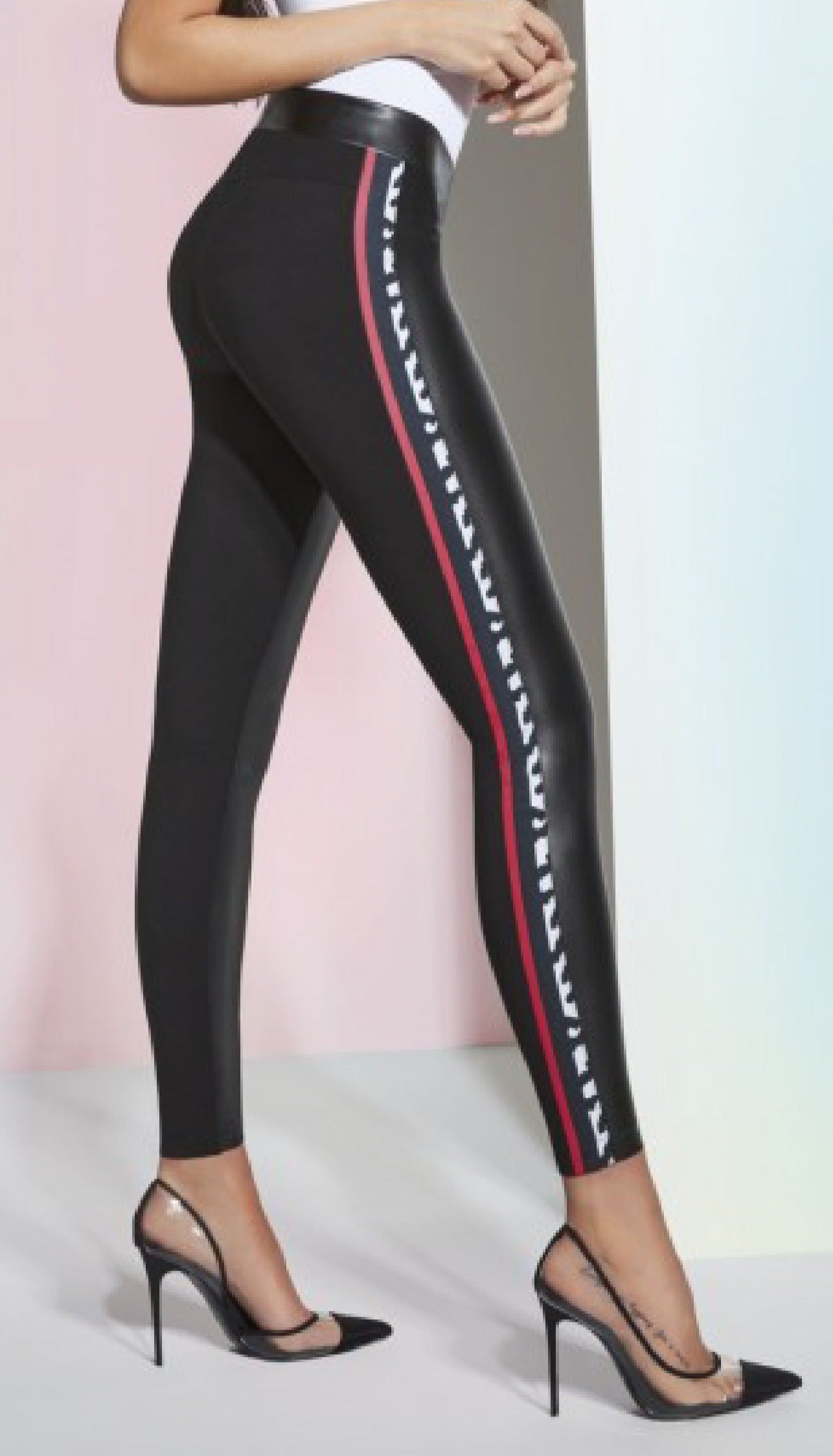 BasBlack Caroline Leggings - Black leggings in 2 fabrics, the front is faux leather and the back is in a plain stretch viscose fabric. They also features a side sports style stripe in red and black and white animal print.