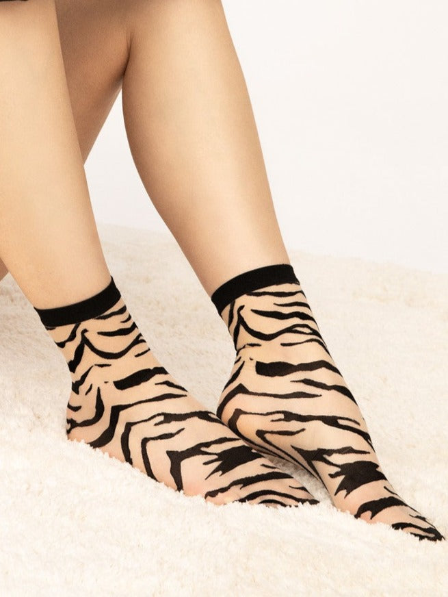Fiore Steppe Socks - Sheer nude fashion ankle socks with a woven black zebra style pattern and plain thin cuff.