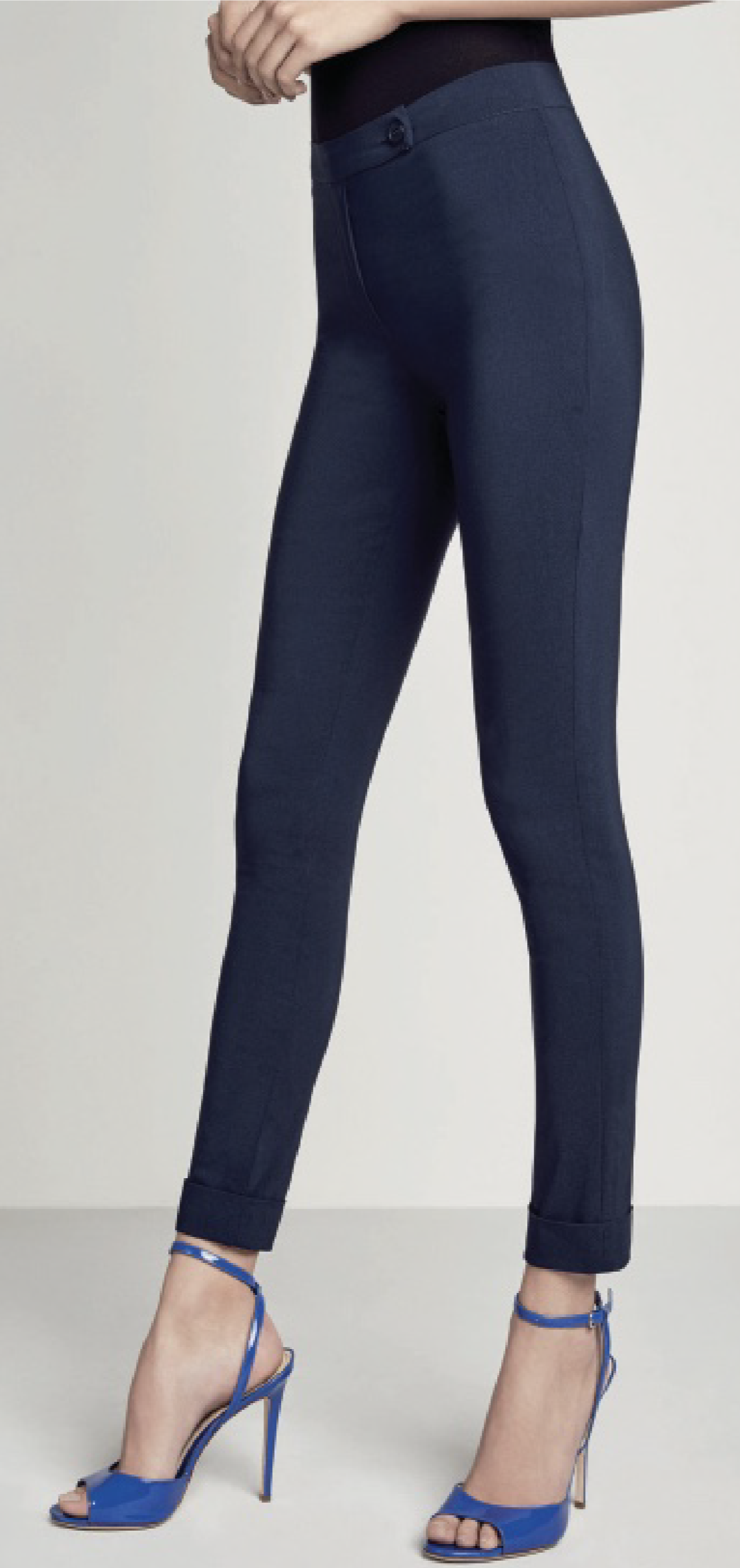 Plain lightweight trouser leggings (treggings) in stretch viscose with front button and zip fastener and turn up cuffs. Available in black and navy.