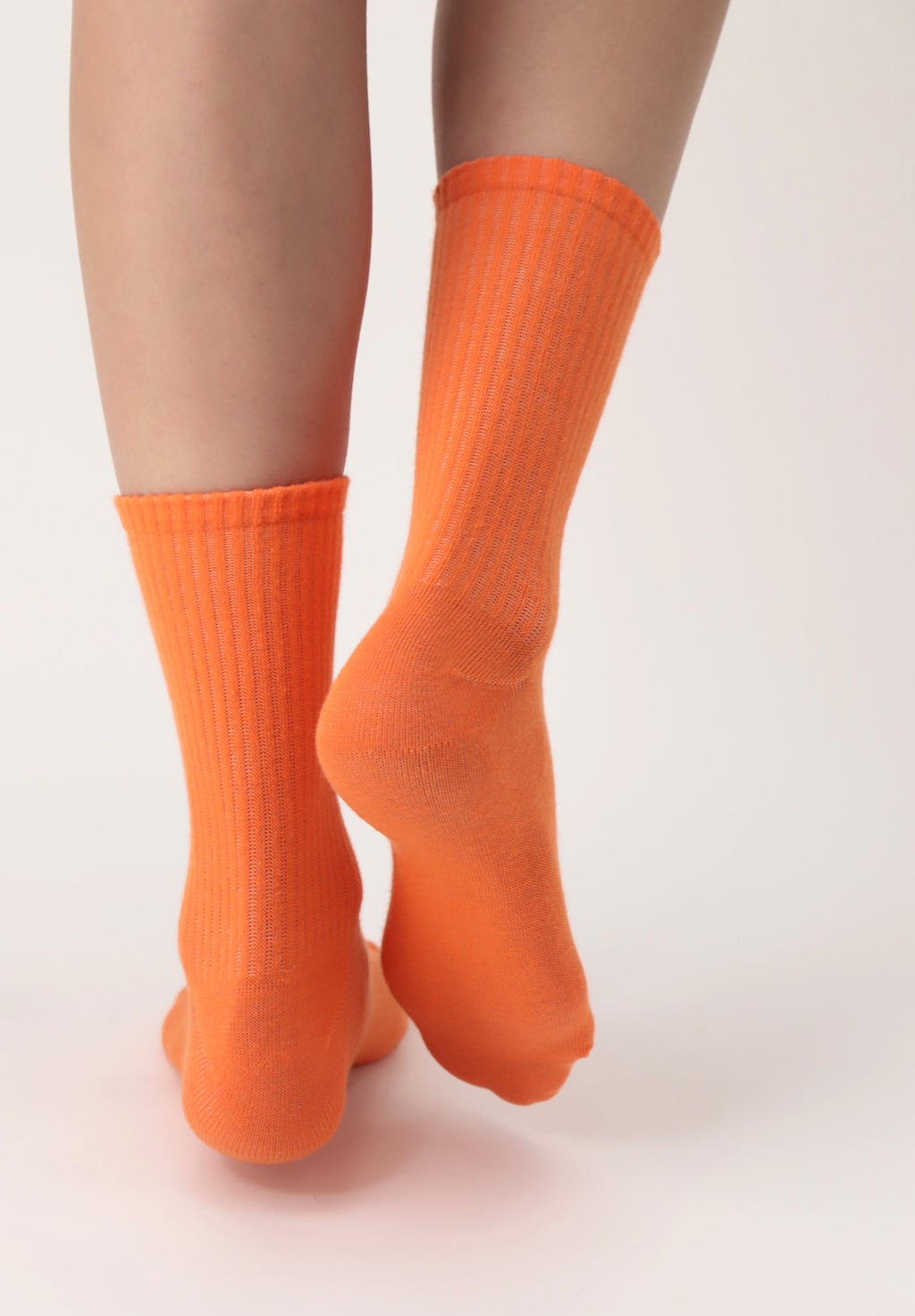 OroblÌ_ Color Block Twin Socks - Ribbed cotton mix bootie ankle high socks twin pack with shaped heel. One pair is white with orange, green, blue and pale pink lines on the back and the other is a plain bright bold orange colour.